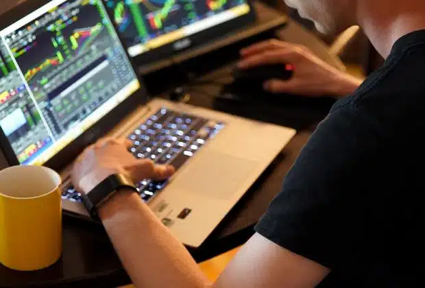 man sitting in front of the laptop